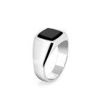 Silver ring with a black stone on a white background