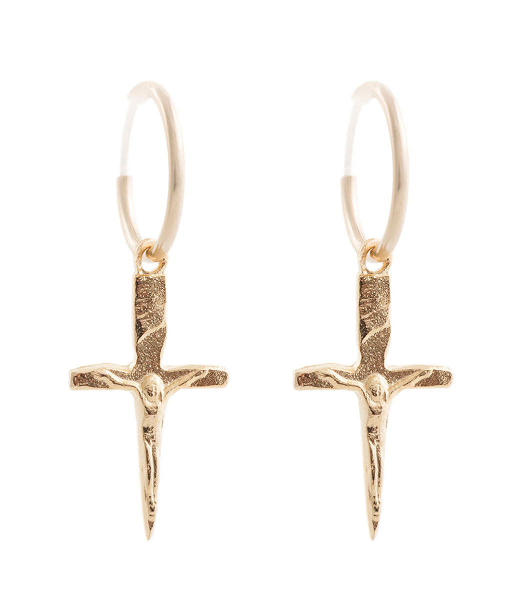 Gold cross-shaped earrings on a white background