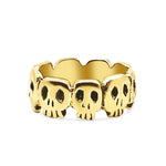 Gold skull ring on a white background