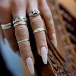 small signet ring on hand