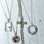 silver pendants with stones