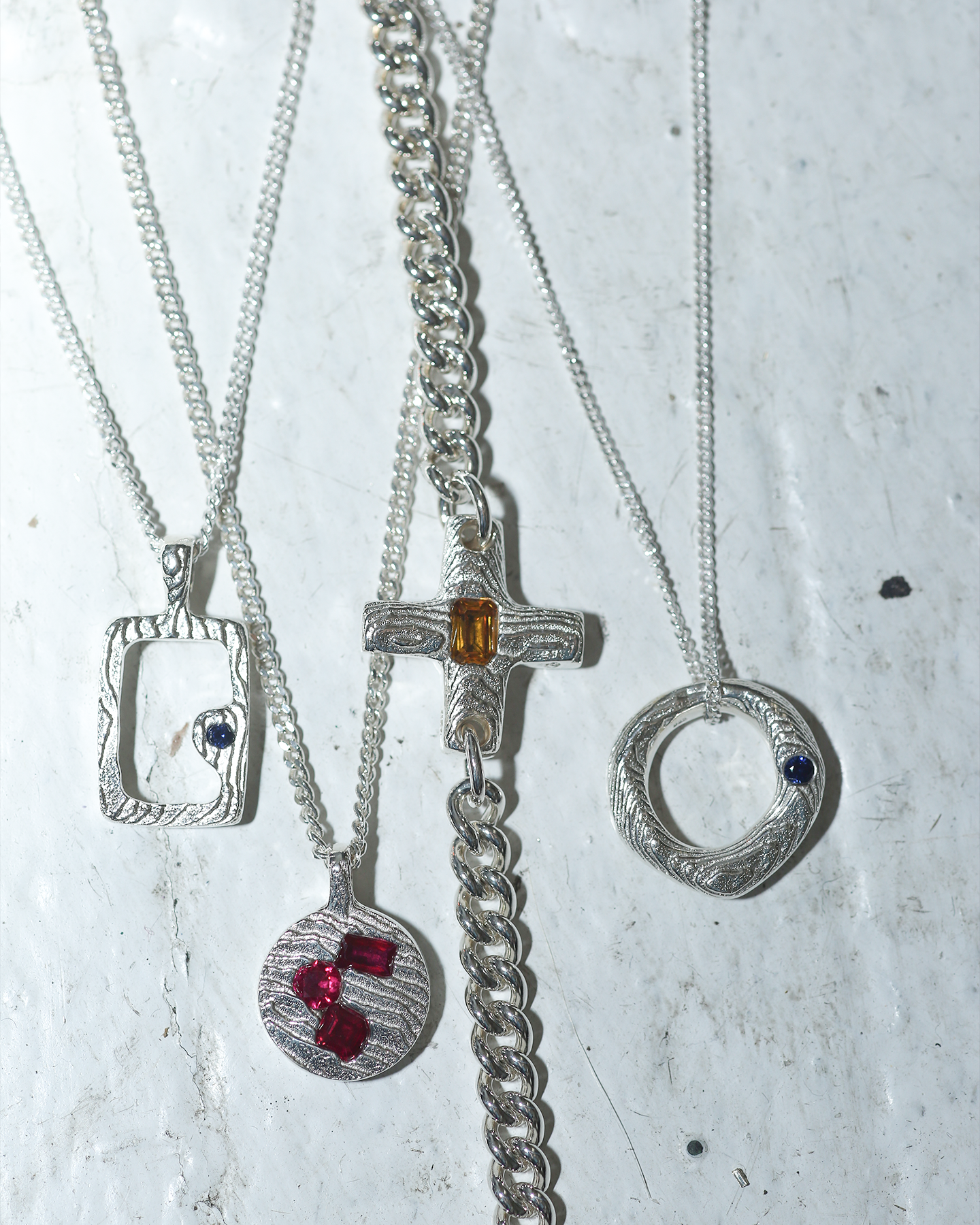 silver pendants with stones