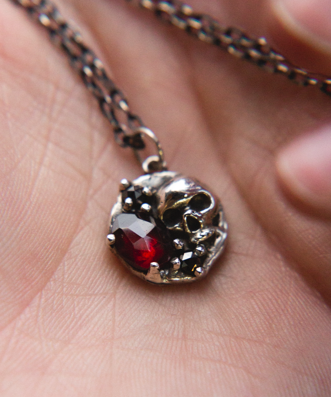 skull necklace in hand