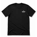 Black t-shirt with a small white logo on a white background