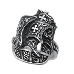 Silver ring with intricate designs and cross patterns on a white background