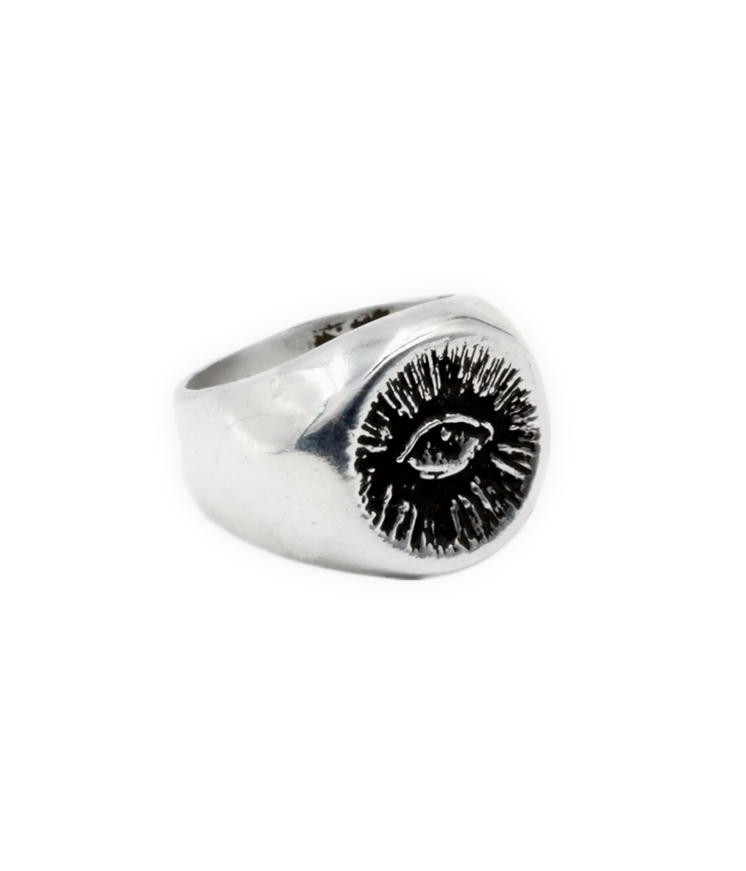 eye signet ring on white background