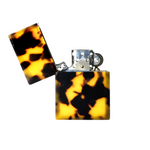 Tortoiseshell patterned lighter on a white background