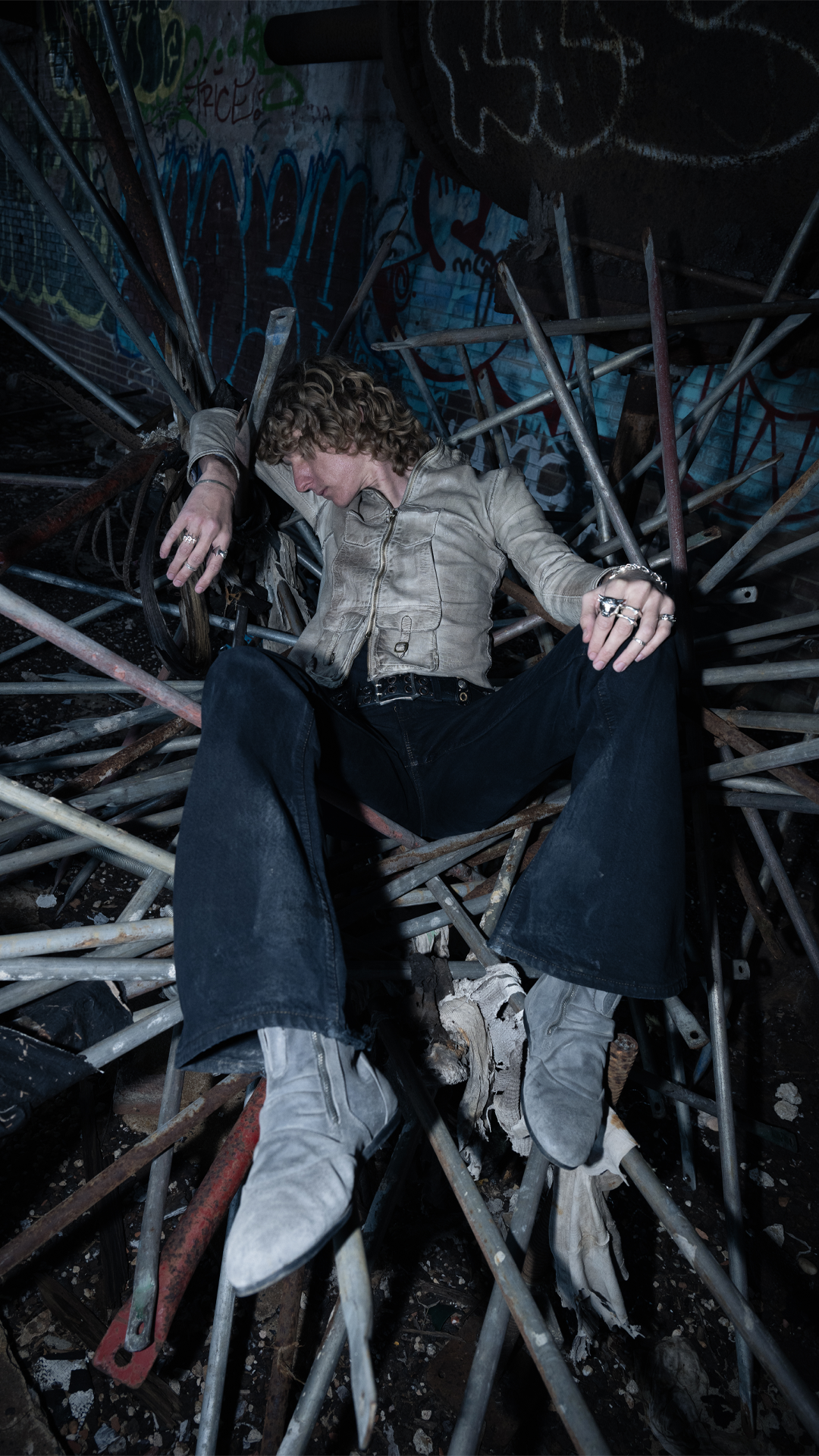 Woman with a skull on a table against a white background