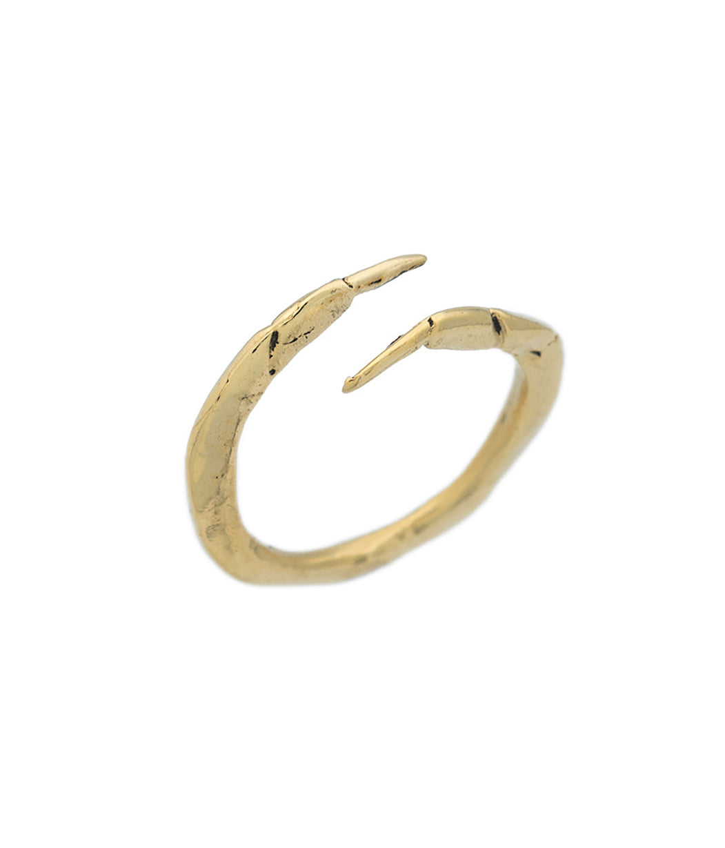 Gold ring with a unique design on a white background